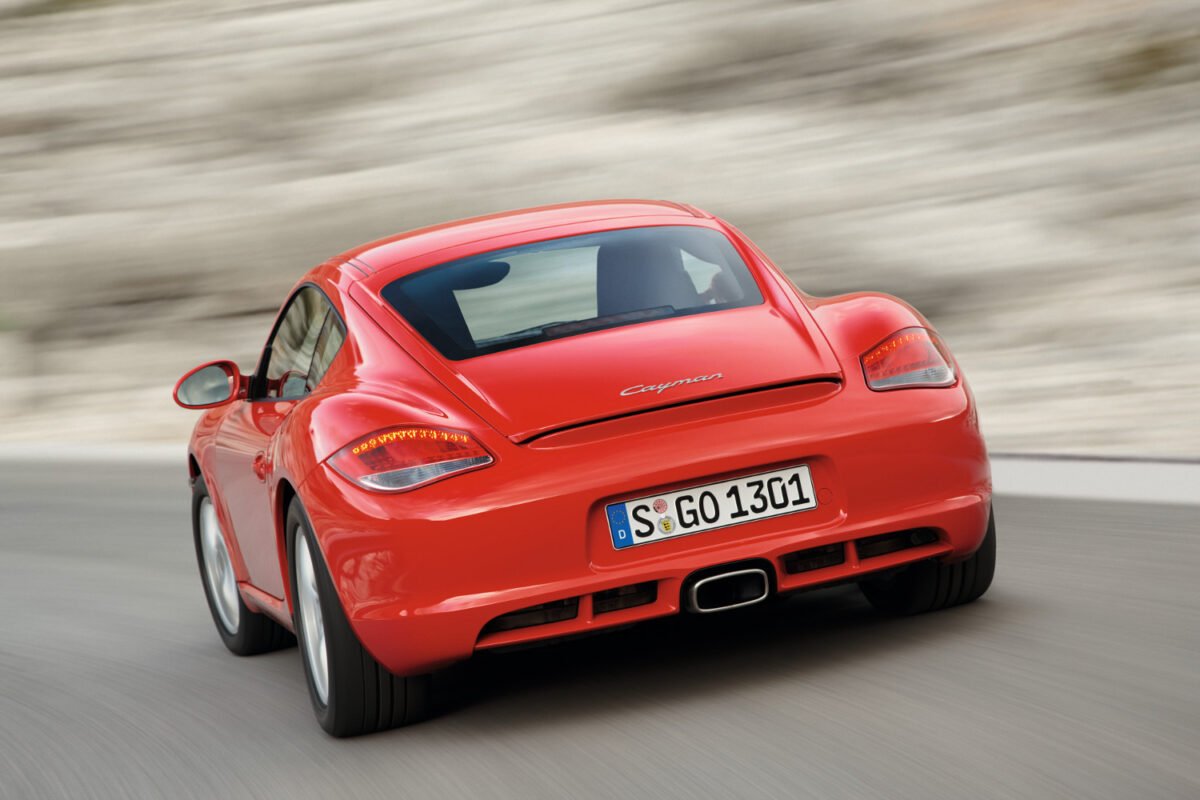 2009 Porsche Cayman on the road rear