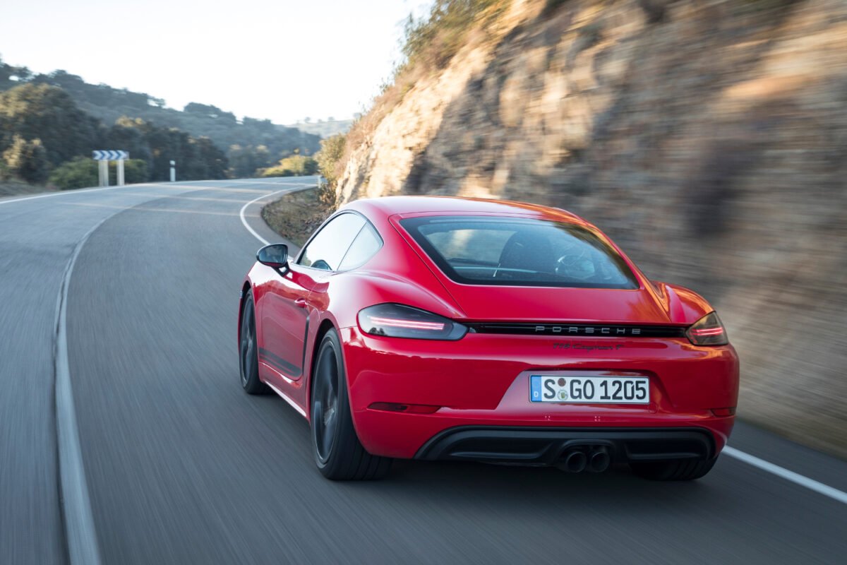 2020 Porsche 718 Cayman T on the road rear